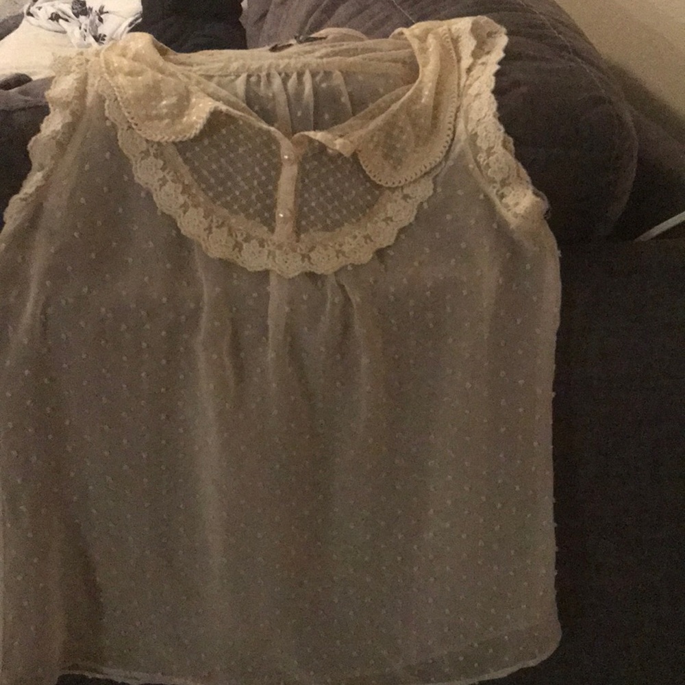 Sleeveless see through top.
